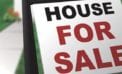 House for sale sign Mortgage requirements a barrier to homeownership